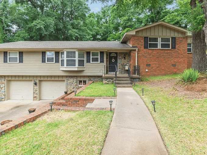 Suburban house with driveway and front yard.